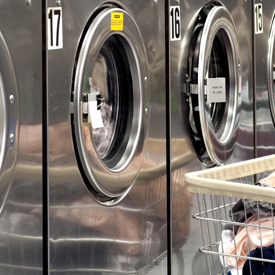 Row Of Washers With Cart Of Clothes 1800X900